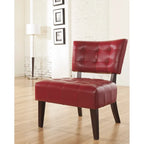 Fauteuil capitonné surdimensionné