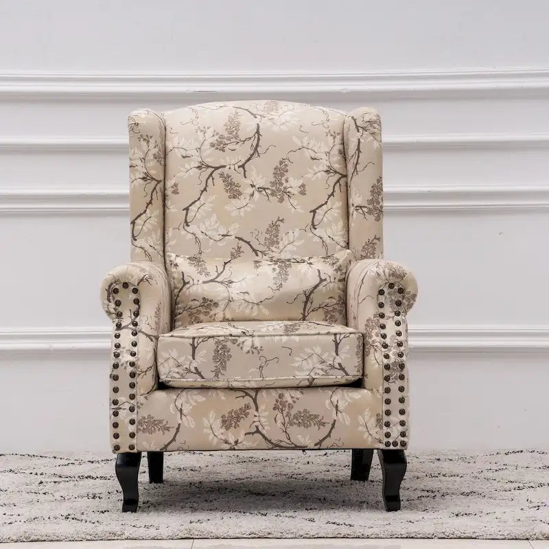Fauteuil capitonné à oreilles avec clous de tapissier
