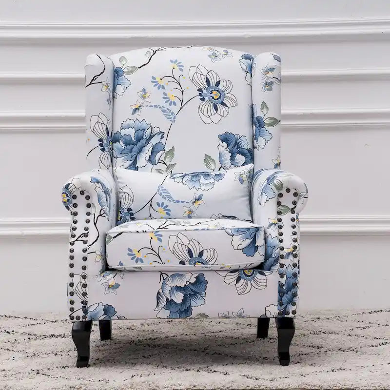 Fauteuil capitonné à oreilles avec clous de tapissier