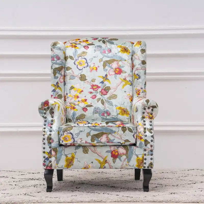 Fauteuil capitonné à oreilles avec clous de tapissier
