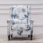 Fauteuil capitonné à oreilles avec clous de tapissier