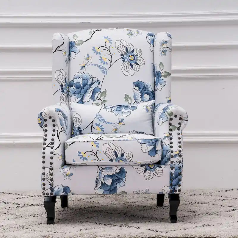 Fauteuil capitonné à oreilles avec clous de tapissier