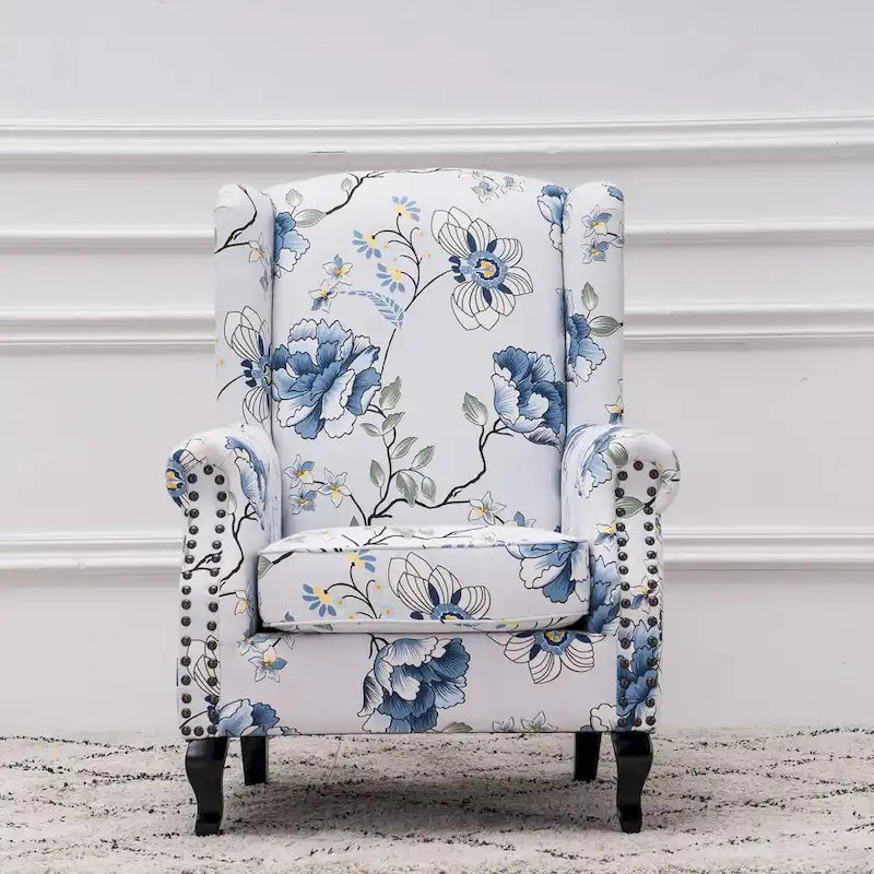 Fauteuil capitonné à oreilles avec clous de tapissier