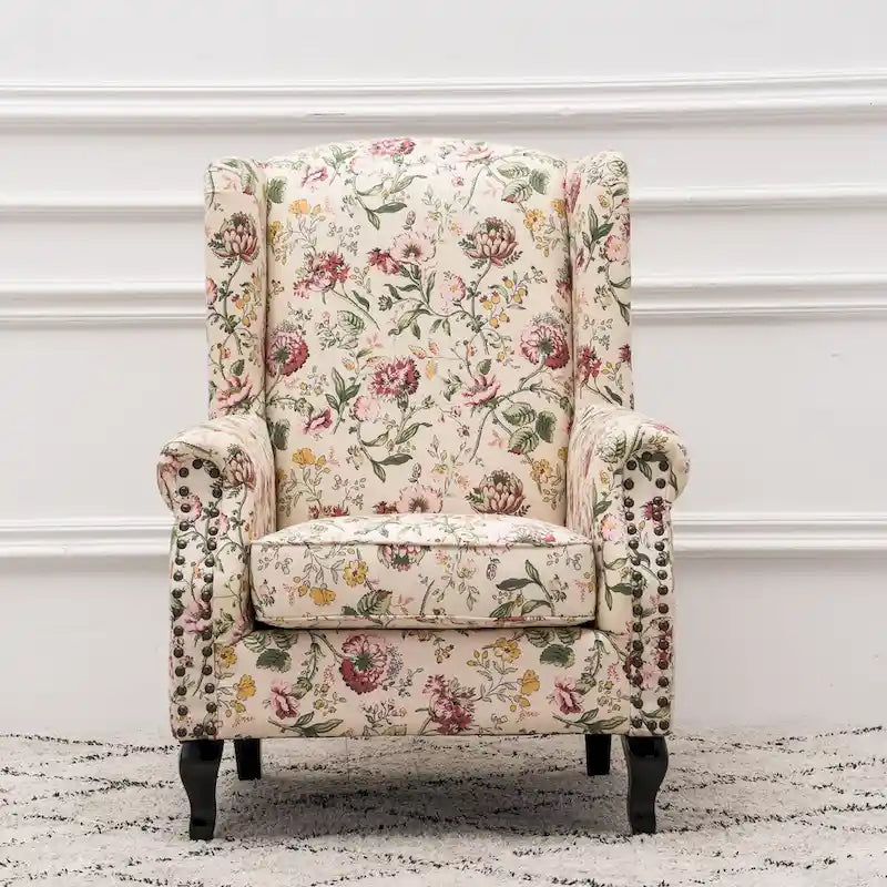 Fauteuil capitonné à oreilles avec clous de tapissier