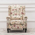 Fauteuil capitonné à oreilles avec clous de tapissier