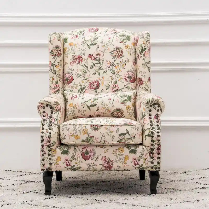 Fauteuil capitonné à oreilles avec clous de tapissier