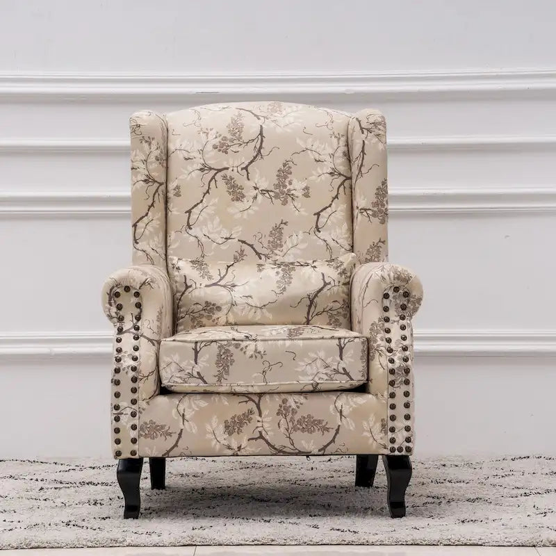 Fauteuil capitonné à oreilles avec clous de tapissier