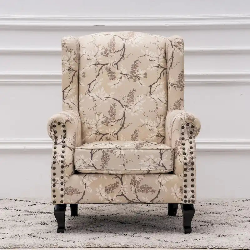 Fauteuil capitonné à oreilles avec clous de tapissier