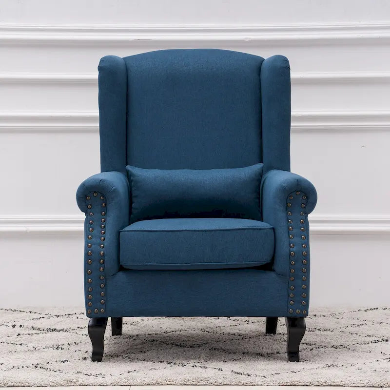 Fauteuil capitonné à oreilles avec clous de tapissier