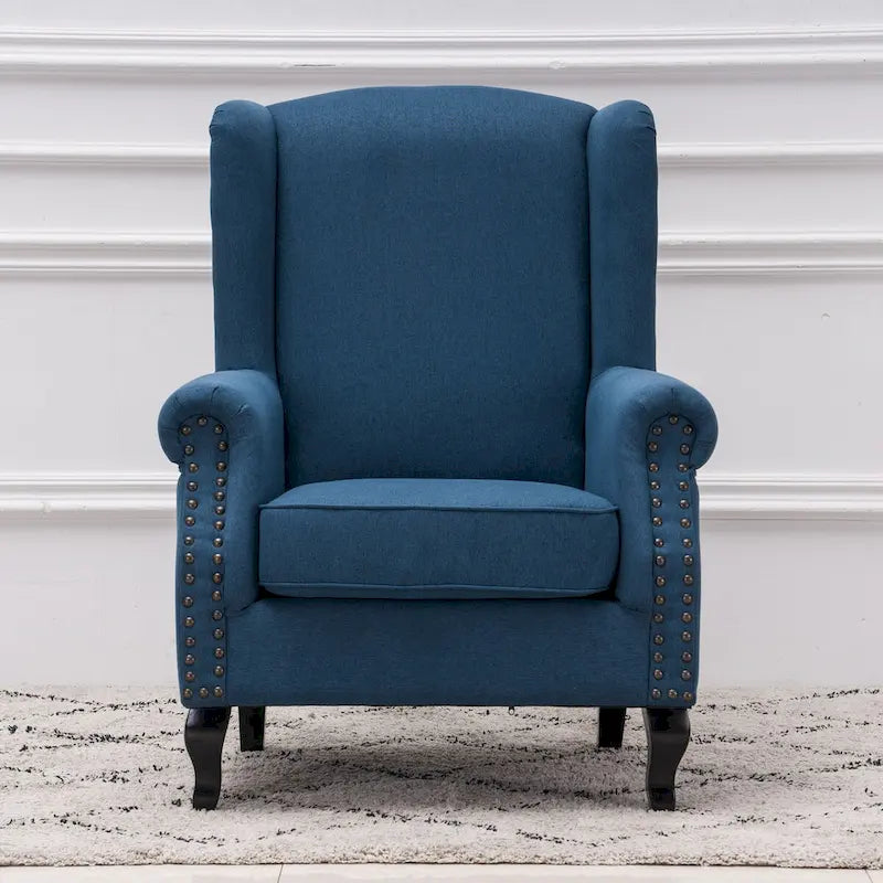 Fauteuil capitonné à oreilles avec clous de tapissier