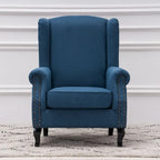 Fauteuil capitonné à oreilles avec clous de tapissier