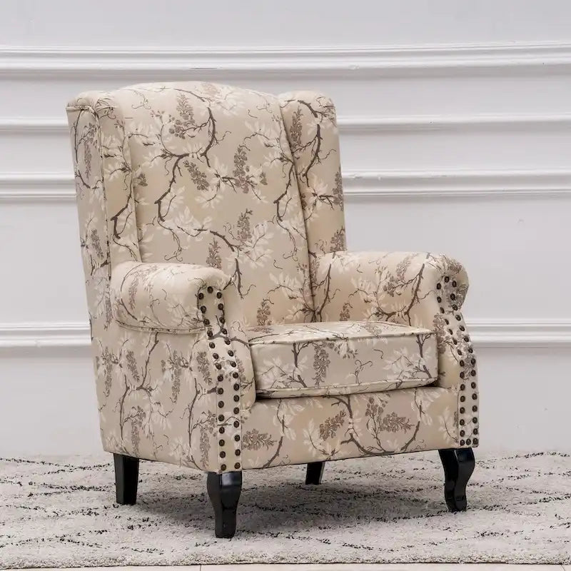 Fauteuil capitonné à oreilles avec clous de tapissier