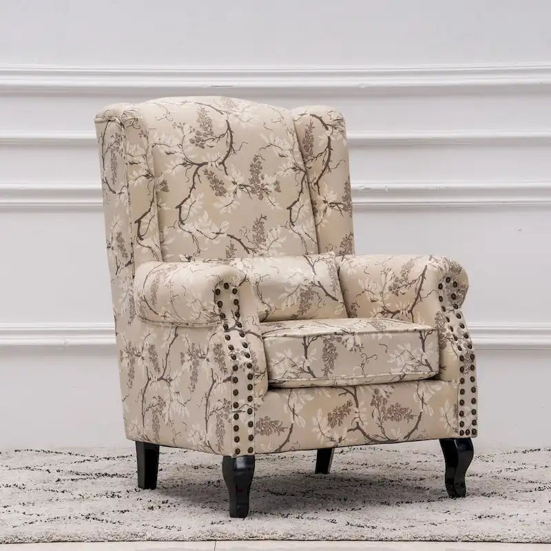 Fauteuil capitonné à oreilles avec clous de tapissier
