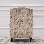 Fauteuil capitonné à oreilles avec clous de tapissier
