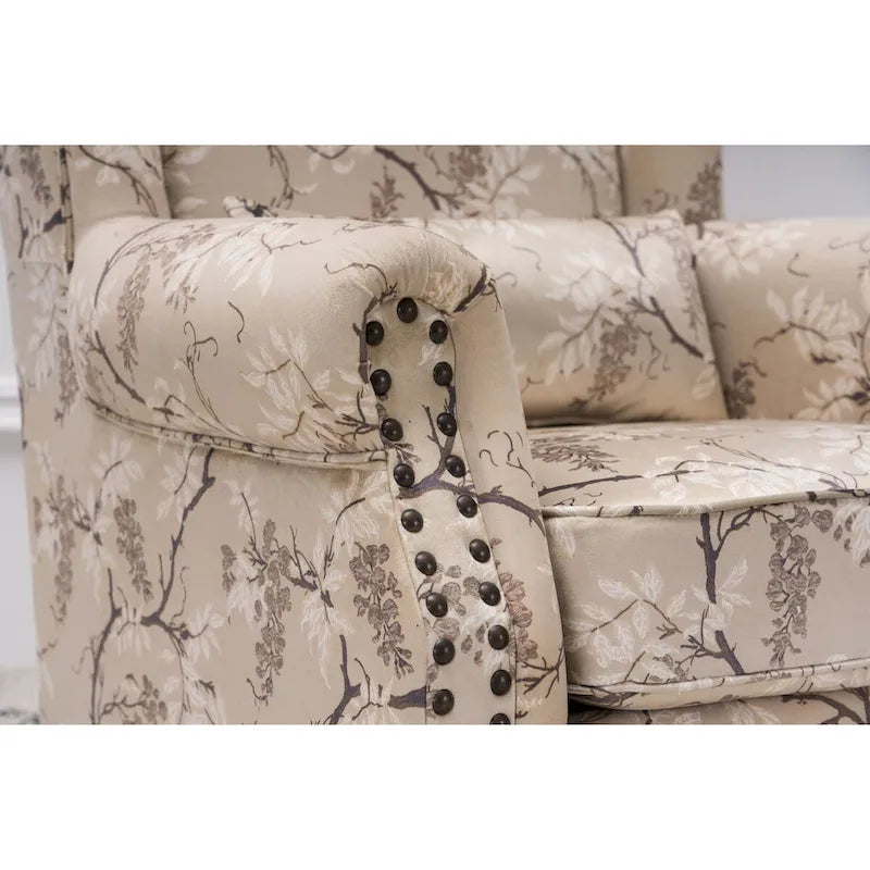 Fauteuil capitonné à oreilles avec clous de tapissier