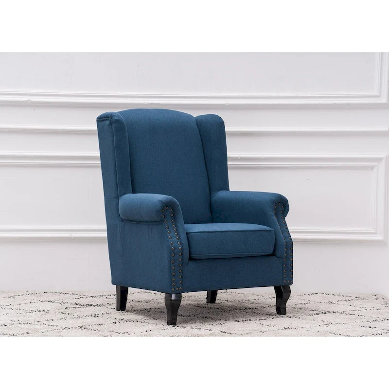 Fauteuil capitonné à oreilles avec clous de tapissier