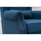 Fauteuil capitonné à oreilles avec clous de tapissier