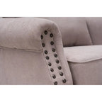 Fauteuil capitonné à oreilles avec clous de tapissier